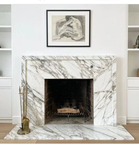 Gorgeous, clean marble framing the fireplace Modern Marble Fireplace Surround, Marble Fireplace With Mantle, Fireplace Marble Surround, Marble Fireplace Ideas, Marble Tile Fireplace, Modern Marble Fireplace, Contemporary Extension, Granite Fireplace, House Contemporary