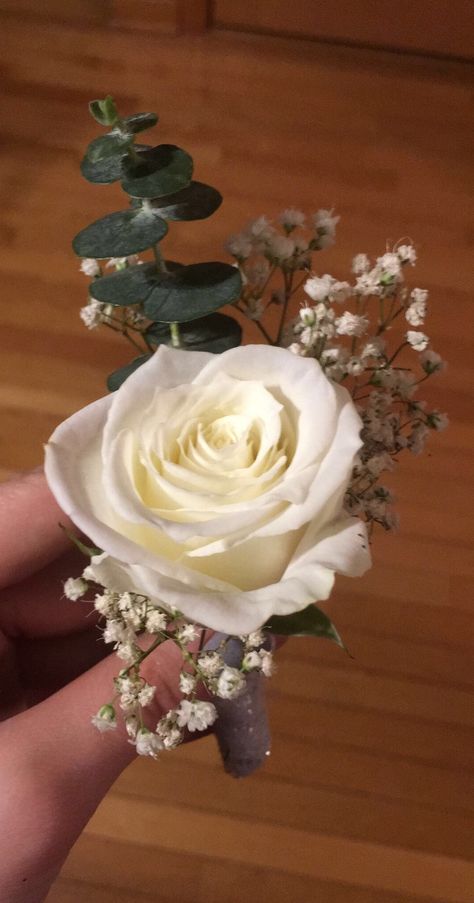 eucalyptus, white rose, and baby’s breath boutonnière White Rose Boutonniere Prom, Simple Rose Corsage, Simple Wedding Bouquet Ideas Diy, White Rose Eucalyptus Babys Breath Bouquet, Button Holes Wedding Eucalyptus, White Rose Bouquet Prom, White Rose And Eucalyptus Boutonniere, White And Eucalyptus Boutonniere, White Rose Corsage And Boutonniere