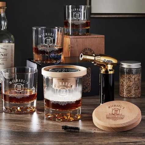 Have the coolest whiskey tasting ever with this incredible personalized bourbon smoker kit! Includes wood bourbon smoker, blowtorch, metal mesh filter, a jar of wood chips, cleaning brush, and four double old-fashioned glasses. The lid of the bourbon smoker and the glasses are all personalized with an initial and two lines of text. With the bourbon smoker kit, you can infuse a delicious new smoky flavor into your whiskey to give it an entirely different flavor palate. Perfect for whiskey tasting Drink Smoker, Whiskey Smoker, Cocktail Smoker, Wood Smokers, Best Groomsmen Gifts, Whiskey Decanter Set, Whiskey Lover Gifts, Personalized Whiskey, Whiskey Gifts