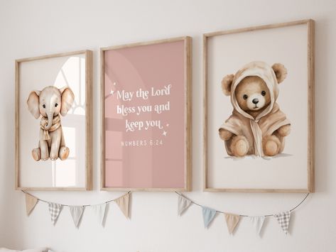 Elevate your baby girl's nursery with this adorable printable wall art featuring a charming baby elephant and teddy bear, accompanied by the comforting Bible verse Numbers 6:24: "May The Lord bless you and keep you." Infuse her space with love, protection, and divine blessings. Perfect for girls' room decor, this artwork serves as a meaningful new baby gift or baptism present, creating a serene and blessed atmosphere in her nursery. ⚠️ BEFORE BUYING Please remember this is an INSTANT PRINTABLE DOWNLOAD, No physical items will be shipped. Frames in pictures are not included. There are no refunds due to the nature of the instant digital download. 🤍🤍WHAT'S INCLUDED🤍🤍 You will receive 5 high-quality PDF files in different size ratios, each designed to fit different print sizes. Whether you Bear Nursery Girl, Boho Girl Nursery, Room Decor Girl, Girl Nursery Wallpaper, Elephant Nursery Prints, Teddy Bear Nursery, Nursery Prints Girl, Christian Nursery, Divine Blessings