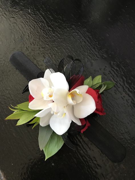 White orchid with red roses corsage White And Red Corsage And Boutonniere, Red Dress Corsage, White And Red Corsage, Corsage For Red Dress, Red Corsage Prom, Red And White Corsage, Prom Corsage Red, Red Rose Corsage, Orchid Corsage