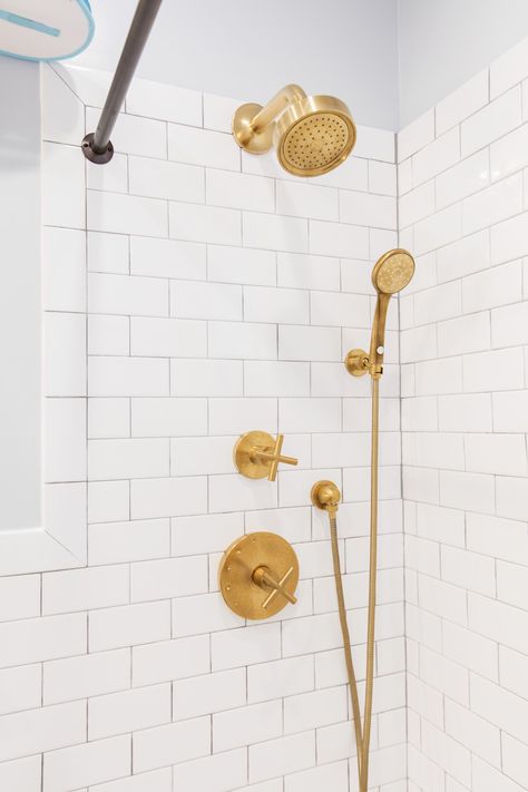 Daniel and Kate's bathroom remodel features gold shower fixtures that stand out against bright white subway tile. White Subway Tile Bathroom Gold Fixtures, Shower Fixtures Brass, White Subway Tile Shower Gold Fixtures, White Shower Gold Fixtures, Gold Shower Hardware, Shower Fixtures Gold, Shower Fixture Ideas, Gold Shower Fixtures, Gold Shower Faucet