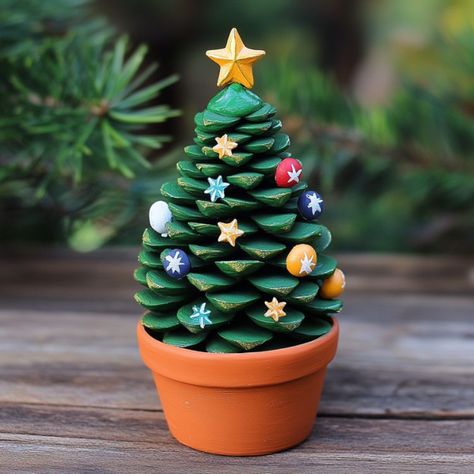 Clay Pot Christmas Trees, Christmas Pine Cones Crafts, Diy Terracotta Christmas Ornaments, Terracotta Pot Christmas Ideas, Terra Cotta Christmas Crafts, Mini Clay Pot Christmas Ornaments, Terracotta Pot Ornaments, Christmas Plant Pots Gift Ideas, Clay Pot Christmas Tree