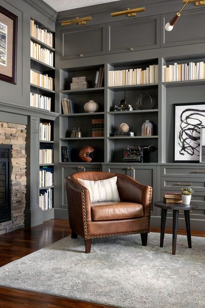 Client Reveal: Altadore Project. Bold paint, cool concrete and warm woods give this home a modern update reminiscent of an Italian Villa. Black Built Ins, Gray Library, Masculine Study, Dads Office, Library With Fireplace, Office With Fireplace, Library Room, Home Library Design, Living Comedor