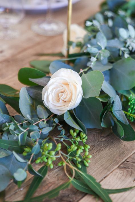 How to make a real eucalyptus table garland using a faux garland as a base. By tucking real branches into the faux garland you save time and money Diy Eucalyptus Garland, Diy Eucalyptus, Wooden Chargers, Wedding Table Garland, Navy Table, Spring Garland, Artificial Eucalyptus Garland, Tulips Arrangement, Table Garland