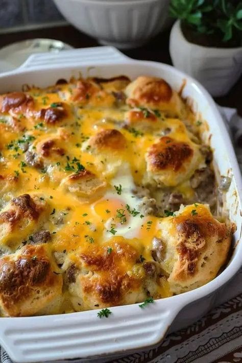 Biscuits and Gravy with Sausage and Egg Breakfast Casserole - Recipecs Biscuits And Gravy Egg Casserole, Sausage And Biscuit Breakfast Casserole, Sausage Egg And Biscuit Casserole, Biscuit Sausage Egg Casserole, Biscuits And Gravy For A Crowd, Easy Breakfast Casserole With Biscuits, Sausage Recipes Breakfast, Egg And Sausage Casserole, Biscuit And Gravy Casserole