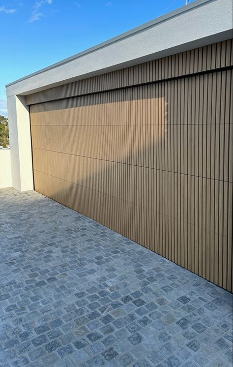 light timber garage door Vertical Garage Doors, Garage Facade Ideas, Coastal Front Door Entrance, Luxury Garage Doors, Japandi Garage, Modern Wood Garage Door, Batten Garage Door, Garage Door Interior, Mid Century Garage Door