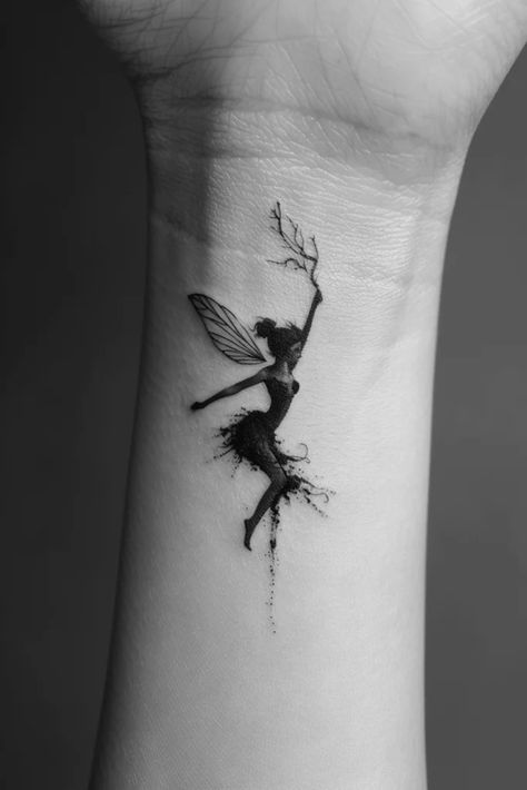 Top 10 Awesome Fairy Tattoo Ideas Dark Tinkerbell Tattoo, Pixie Tattoo Small, Fairy Tattoo Designs Simple, Fairy Wrist Tattoo, Dreams Tattoo Ideas, Fairy Tattoos For Women, Simple Fairy Tattoo, Silhouette Tattoo Ideas, Fairytale Tattoo Ideas