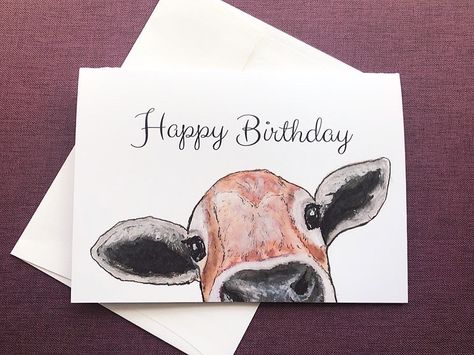 "This is a Handmade 5\"x7\" notecard, perfect for the cow enthusiast. The greeting card was printed on good quality card stock and is blank inside. Card will be packaged securely inside a cardboard envelope to ensure safe shipping and prevent bending.  - Packaged in a clear sleeve suitable for gift giving. - Blank inside to write in your own greeting as an adorable Birthday Card! - Prints available too, please send message if interested.  Original illustration was painted by me, Marian Gardner.  Special Orders: If you would like to order more cards than what I have in stock, or if you'd like to have a message printed on the inside of the cards, please message me and I'd be happy to do a custom order for you! please note that special orders take 2-3 weeks before they will arrive to you. Tha Cow Birthday Cards Handmade, Cow Cards Handmade, Cow Birthday Cards, Cow Card, Country Birthday, Cow Birthday, Birthday Cards For Boyfriend, Birthday Cards For Mom, Watercolor Birthday