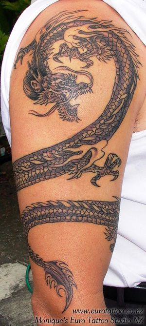 Not sure about THIS dragon, but I love the idea of a dragon wrapped AROUND the arm. Surprisingly VERY hard to find pictures of. All I find are just stationary on the arm. Dragon Tattoo Wrapped Around Arm, Personal Tattoos, Dragon Tattoo Arm, Tattoos Dragon, Tato Naga, Around Arm Tattoo, Dragons Tattoo, Wrap Around Tattoo, Dragon Tattoos For Men