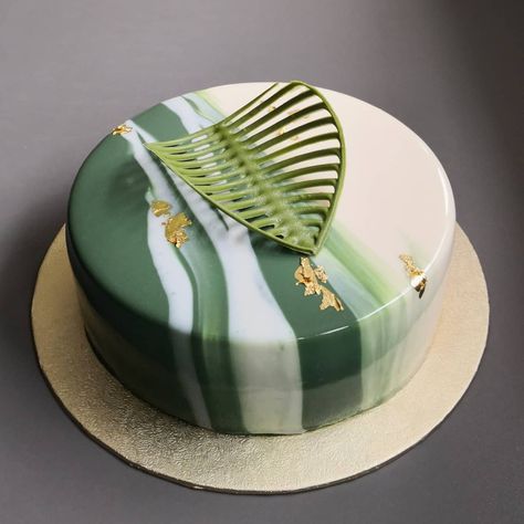 Coffee sponge cake layered with espresso syrup, mascarpone cream mousse and mirror glaze. Decorated with chocolate matcha leaf. Green Mirror Glaze Cake, Mousse Cake Mirror Glaze, Mousse Cake Decoration Ideas, Mousse Cake Design, Mirror Glaze Cake Design, Entremet Cake Design, Glaze Cake Decoration, Mirror Glaze Cake Decoration, Matcha Leaf