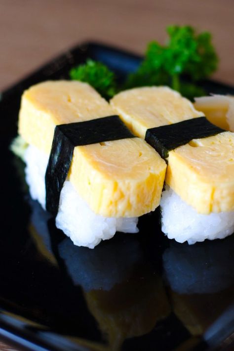 Tamago Sushi is sweet and savory, with a light, fluffy texture. It’s made with Japanese Tamago Egg Recipe, Tamago Nigiri, Easy Sushi Rolls, Dragonfruit Lemonade, Rice Bites, Tamagoyaki Recipe, Tamago Sushi, Egg Sushi, Sushi Ingredients