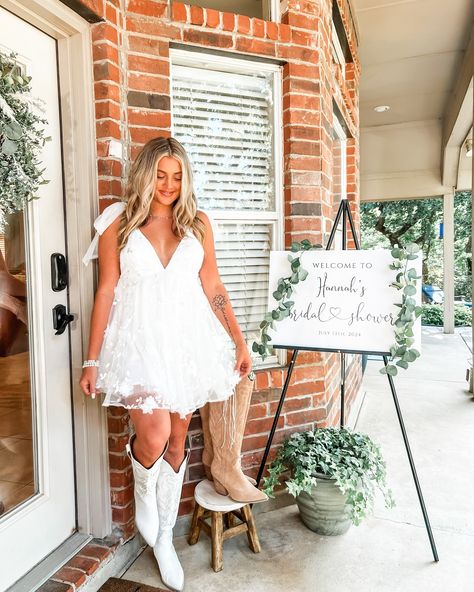 Bridal Shower 7.13.2024 - Boots & Bubbly 👢🫧 • Dress - @selfie_leslie Boots - @willowchicboutique Necklace - @smilebelleofficial • #bridalshower #bridalshowerideas #bridalshowerdress #bride #bridestyle #bridesofinstagram #dfw #dallastexas #trending #trendingnow #viral #fyp #explorepage✨ #cuteoutfits #summerdress #whitedress #bootsandbubbly Country Wedding Dress Short, Wedding Dress And White Boots, Bridal Shower Outfit For Bride Western, After Wedding Bride Outfit, Wedding Reception Dress For Bride Country Cowgirl Boots, Short Wedding Dress With Cowgirl Boots, Reception Dress Country, Short Wedding Dress Cowboy Boots, Country Wedding Reception Dress