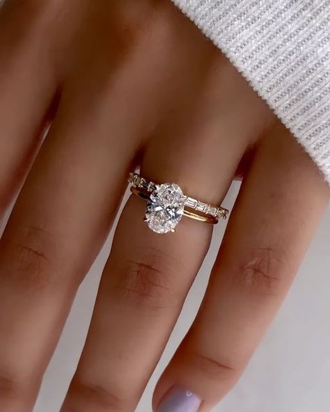 Nuno Rocha on Instagram: "This @diamondboi engagement ring was designed featuring a 1.40 carat oval cut diamond.  The oval cut is an elongated shape with rounded edges, and it has a brilliant cut that maximizes the diamond's fire and sparkle.  I paired it with this beautiful reverse baguette wedding band, a perfect complement. A baguette is a type of diamond cut that features long, slender diamonds that are cut to fit together seamlessly. They have a unique, angular shape that adds visual interest and modern flair to the design.
The reverse baguette band creates a smooth and streamlined look that enhances the beauty of the centre diamond.

What do you all think of this pairing ? 

Why join the @diamondboi family !

💎 💎 💎  4 Time back to back Top Choice GTA Jeweller winner 2020, 2021 , 2 Wedding Bands To Pair With Oval, Baguette Band With Oval Ring, Wedding Band Oval Solitaire, Elongated Oval Engagement Ring With Wedding Band, Oval Engagement Ring Wedding Band Pairing, Baguette Cut Wedding Band, Oval Engagement Ring With Baguette Wedding Band, Emerald Wedding Band With Oval Engagement Ring, Ring Stacking Ideas Wedding Bands Oval