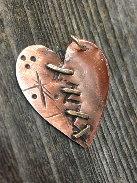 Copper, Heart Pendant, mixed metal, handmade. Copper heart shaped pendant, stamped and hand tooled wounded/broken heart design w/ brass wire stitches and jump ring. Copper was recovered from homes lost in the Tubbs fire 10-09-17, Fountaingrove area of Santa Rosa, CA. Mixed Metals Jewelry Style, Rings With Beads, Geometric Silver Jewellery, Metal Hearts, Metal Art Jewelry, Wire Heart, Wrapped Rings, Silver Jewelry Diy, Copper Jewellery