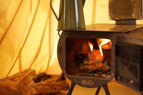 Using a wood burning stove inside your tent is a great way to stay warm and dry during winter camping expeditions. Read my tips on doing this safely! Tent Wood Stove, Diy Wood Burning, Best Tent, Tent Heater, Camping Wood Stove, Diy Wood Stove, Canvas Bell Tent, Cozy Camping, Tent Living