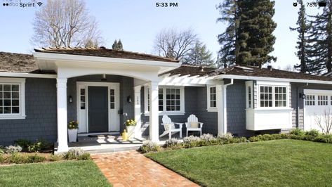 Patio could extend past walk way to bay windows.  Push plantar box forward toward the street to accommodate patio.  Add pergola over bay window.  Add another peak over the entryway off the garage.  Basically, flip the front of this house so pergola and patio are on the left. Painted Brick Ranch, Best Exterior Paint, Ranch House Exterior, Ranch Remodel, Gray House, Ranch Exterior, Brick Ranch, Home Exterior Makeover, Exterior Paint Colors For House