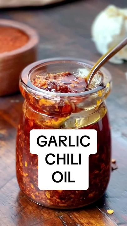 There is a link in my profile for homemade Garlic Chili Oil! #iamhomes... | Chili Oil | TikTok Garlic Oil Recipe, Garlic Chili Oil, Chili Oil Recipe, Homemade Chili Recipe, Homestead Recipes, Homemade Sauce Recipes, Food Swap, Garlic Oil, Homemade Chili