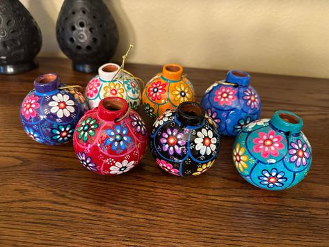 Traditional Mexican Clay Ornament, pre-strung. Each colorful hand painted piece is unique. Made of clay, but not heavy. These ornaments are perfect to decorate a Christmas tree, a wreath or even look great as a gift! Each ornament is handmade out of clay and hand painted with beautiful floral designs by talented artisans from the state of Guerrero.  You will receive a beautiful hand painted ornament in a random color, if you buy more than one you will not receive two of the same color.  Each orn Mexican Christmas Tree Ideas, Diy Mexican Christmas Ornaments, Mexican Theme Christmas Tree, Mexican Christmas Ornaments, Mexican Christmas Tree, Mexican Christmas Traditions, Mexican Ornaments, Clay Christmas Ornaments, Mexican Christmas Decorations