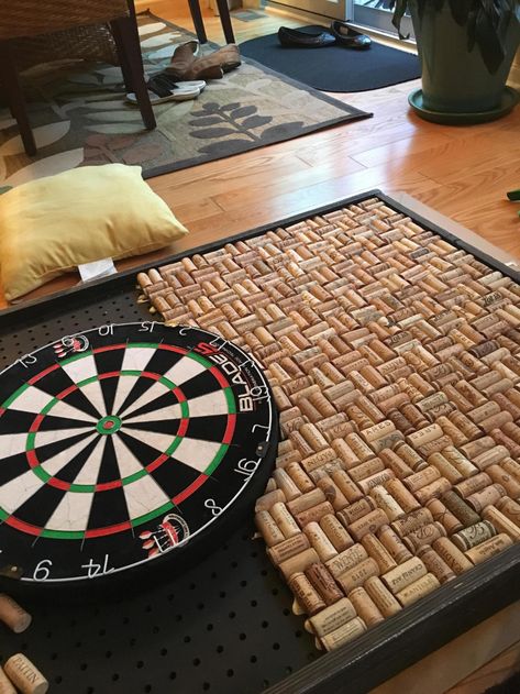 Wife and I made a Dartboard Backdrop. (She has bad aim.) It measures 2.5 x 3.5ft and used nearly 800 wine corks, 2 magnum bottles of adhesive, and a bit of ingenuity. Total cost for everything was under $200. - Album on Imgur Diy Dartboard, Dartboard Backer, Cork Dartboard, Dart Board Wall, Wine Cork Board, Cork Crafts Diy, Wine Cork Diy, Wine Cork Art, Dart Boards