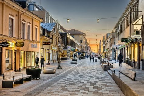 The design derives from the contemporary needs of a functional yet attractive pedestrian street in the city center. We aimed to create an inviting street on a human scale with a unique and clear identity. Design concepts focused on richness in experience, timelessness and small scale. The city’s main shopping street targets a unique identity […] Street Pavement Design, Shopping Street Design, Shopping Street Architecture, Street Scape Design, Street Design Ideas, Pedestrian Street Design, Street Market Design, City Square Design, Commercial Street Design