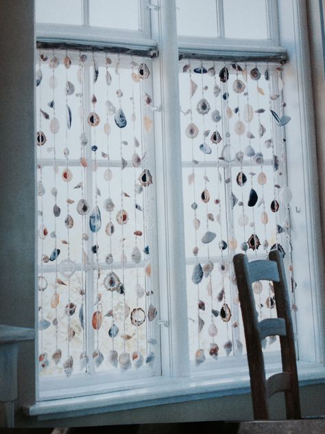 Hand-made shell curtain using rock limpets, whelks and white and black mussel shells Shell Window Hanging, Limpet Shell Crafts, Yachtie Life, Mussel Shell Crafts, Sea Shell Curtain, Floating Crafts, Shell Displays, Shell Curtain, Ocean Diy