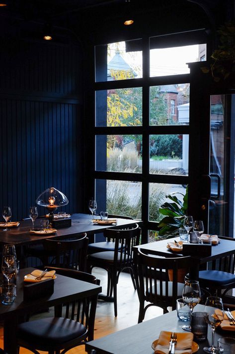 The cool interior in deep blue by Alain Carle at Île Flottante befits its spot in Mile End, one of the city’s trendiest neighbourhoods. There is nothing extravagant in the design here, but the overall impact of the blue walls, dark tables and black metallic windows makes for a refined understated beauty.

Photography: Aleksandra Bjelica

#montreal #canada #travel #restaurant #design #interiors #interiors #cafe Dark Blue Restaurant Interior, Deep Blue Interior, Blue Interior Restaurant, Dark Cafe Interior, Blue Restaurant Interior, Dark Blue Restaurant, Dark Restaurant Interior, Black Cafe Interior, Blue Cafe Interior