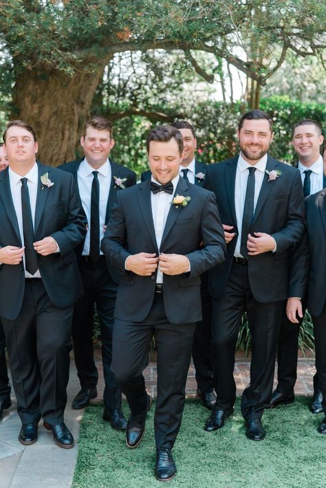 Wedding Groomsmen Black Suit, Black Suit Black Tie Groomsmen, Mens Wedding Suits Black Groom Attire, Groom In Tux Groomsmen In Suits, Groom Tux Groomsmen Suits, Groom And Groomsmen Black Suit, Bridal Party Outfits Groomsmen, Groomsmen In Black Suits, How To Make The Groom Stand Out