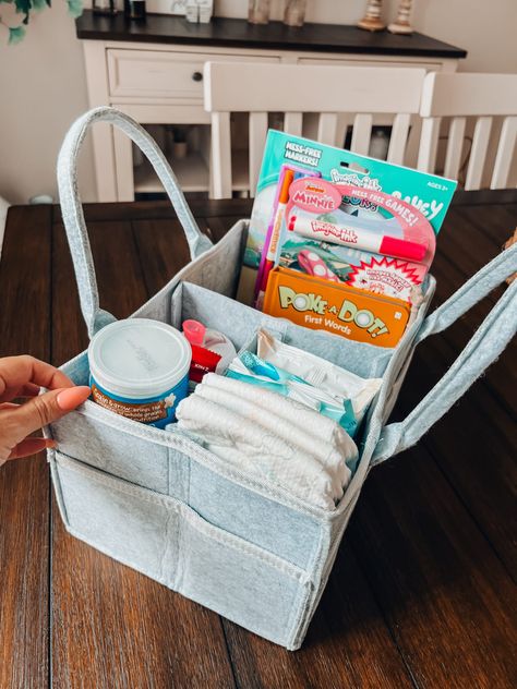 Road Trip Car Caddy - World of Modern Mom Road Trip Caddy, Organize Car For Road Trip, Road Trip Car Organization Travel Hacks, Car Diaper Caddy Essentials, Toddler Long Car Ride Road Trips, Skiing Trip, Car Caddy, Packing Travel, New Car Smell