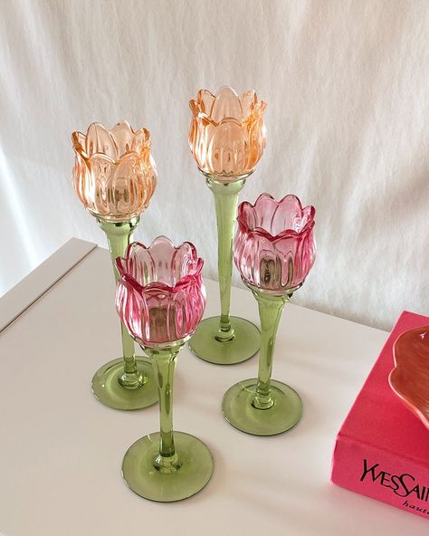 Enhance the ambiance of any space with our charming Tulip Flower Glass Candle Holder. Oh-so delicate, its design evokes the beauty and serenity of colorful tulip flower fields. The translucent glass gently diffuses the candlelight, casting a soft and inviting glow. With its elegant silhouette and intricate detailing, this candle holder adds a touch of sophistication to any decor. Whether used as a centerpiece on a dining table, an accent on a mantel, or to create a relaxing atmosphere in a bath, Pink Dining Room Table Decor, Fake Food Home Decor, Candle Flower Table Decor, Home Decor Whimsical, Fruit Candle Holder, Pink And Green Table Decor, Tulip Home Decor, Cottage Core Table Decor, Floral Brunch Decor