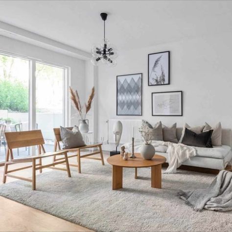 25 Cozy Ways to Embrace the Hygge Life - 1. Surround Yourself Only with Things You Love - Danish homes follow a minimalistic, open style. Edit your environment so you only see items that you love and have meaning when you look around your house. This well-edited living room is bright and airy and leaves plenty of room to focus on the understated art pieces. Minimalist Hygge Living Room, Danish Design Living Room, Scandinavian Living Room Tv, Danish Style Home, Danish Living Room, Danish Living, Hygge Living Room, 50s Home, Scandinavian Homes