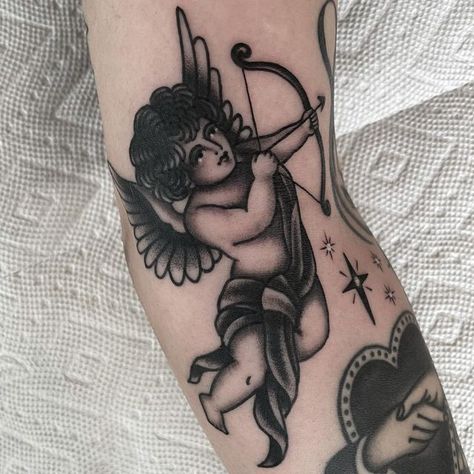 becca genné-bacon on Instagram: "💘" 666 Tattoo, Baby Angel Tattoo, Cupid Tattoo, G Tattoo, Goth Tattoo, Shoulder Arm Tattoos, Traditional Tattoo Art, Tattoo Illustration, School Tattoo