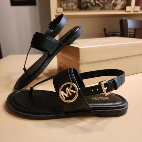 New In Box Thong Sandal Faux Leather 100% Polyurethane Lining: Polyurethane Blend Sole: Rubber Open Toe Gold Tone Buckle Fastening * Color : Black * Us Size - Medium Width Mk Sandals, Luxury Sandals, Girl Time, Pretty Sandals, Michael Kors Sandals, Sandals Flat, Stunning Shoes, Classy Fashion, Summer Sandals