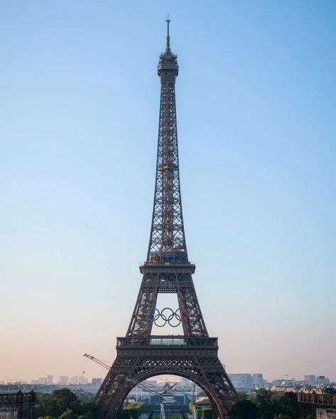 the olympic rings have been installed on the eiffel tower for the paris olympics, adding a stunning new look to the iconic landmark. these rings symbolize the unity and spirit of the games as paris prepares to host athletes from around the world. - #parisolympics #eiffeltower #olympicrings #paris2024 #olympics #cityoflights #sportingevent #iconiclandmark #paris #historyinthemaking #flawdforge Eiffel Tower Olympics, 2024 Paris Olympics, Paris 2024 Olympic Games, Paris Olympics 2024, Olympic Rings, Paris Olympics, Paralympic Games, Paris Summer, Olympic Athletes