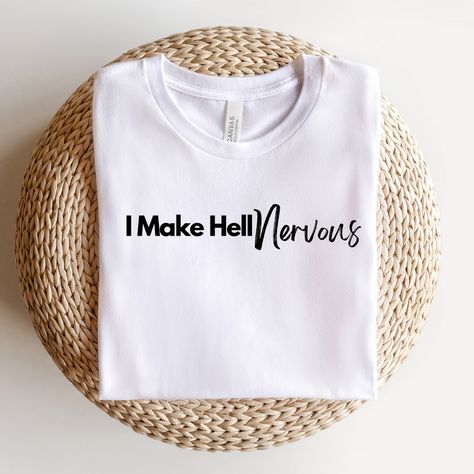 🔥 I Make Hell Nervous 🔥 Ladies, this bold tee is more than a statement—it’s a declaration of your faith and strength in Christ! 💪 As a Christian woman, you are a powerful force, and the enemy trembles at your unwavering trust in God. 💬 Wear it with confidence, and remember: with God by your side, you can overcome anything! 📖 “The Lord is my light and my salvation—whom shall I fear? The Lord is the stronghold of my life—of whom shall I be afraid?” – Psalm 27:1 Get yours today and make a bo... Psalm 27 1, Fear The Lord, Quotes For Shirts, Bold Faith, Christian Shirts Designs, Trust In God, Psalm 27, Dope Quotes, Christian Woman