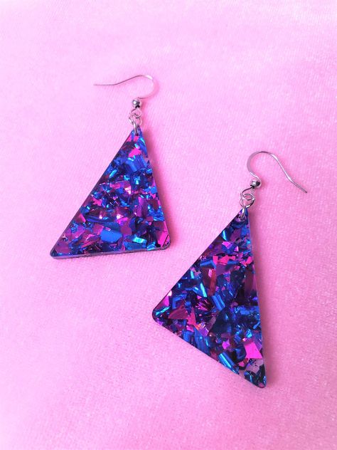 "80s Blue and Fuchsia Chunky Glitter Triangle Geometric Earrings Choice of sterling silver .925 or surgical stainless steel (These earrings pictured are made with surgical stainless steel) Approximately 1.25\" wide, and 2.5\" long from top of metal hook Rad chunky blue and fuchsia glitter earrings! Inspiration straight from the 80s, redesigned for the new retro look. These earrings are sure to sparkle, and packed full of color! This product is made to order, colors may appear slightly different Drip Aesthetics, Shein Earrings, 90s Vaporwave, 80s Accessories, Speculative Design, 80s Jewelry, 80s Earrings, Colorful Glitter, Vaporwave Aesthetic