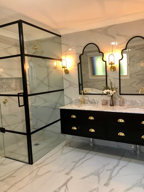 Make a strong statement. This bathroom utilized stone for both floor tiling and wall tiling. To make their bathroom pop, they included a corner shower and our vanity in black detailings. Black vanity, black trim, gold hardware, AND marble as a canvas. WOW! Black Marble Bathroom, Gold Bad, Gold Bathroom Decor, Black And Gold Bathroom, White Marble Bathrooms, Bathroom Design Black, Pantry Kitchen, Traditional Vanity, Bathroom Black