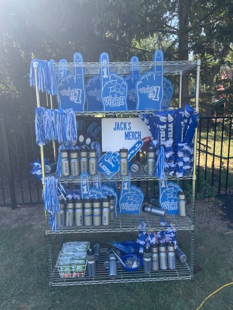 Merch stand for Football themed party University Themed Party, Concert Merch Display, Merch Stand Ideas, Party Favor Display Ideas, School Merch Ideas, Brand Merchandise Ideas, Birthday Merch, Merch Stand, Merch Booth