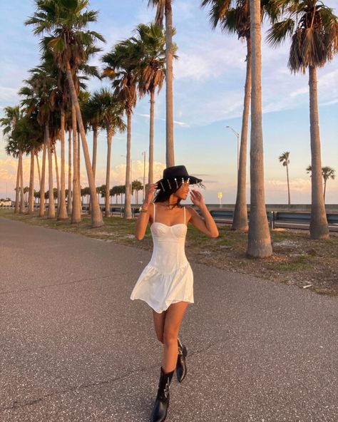 Cowboy Hat Festival Outfit, Coastal Cowgirl Fashion, Coastal Cowboy Party, Cowgirl White Dress, White Dress Cowgirl Boots Outfit, Dress With Cowboy Hat, Coastal Cowboy Outfit, White Cowgirl Outfit, Coastal Cowgirl Dress