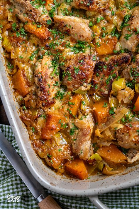 Dive into a delicious bowl of this Scrumptious Chicken, Leek, and Butternut Squash Bake! This enticing dish features tenderly seasoned chicken thighs, perfectly roasted butternut squash, and delightfully buttery leeks, all topped off with a cheesy Parmesan layer. Creamy Roasted Garlic Butternut Squash Pasta Half Baked Harvest, Easy On The Tummy Dinner, Butternut Squash Chickpea Recipes, Chicken Thigh Recipes Half Baked Harvest, Butternut Squash Half Baked Harvest, Fall Squash Dinner Recipes, Bake Dishes For Dinner, Chicken Thigh Butternut Squash, Chicken With Butternut Squash Recipes