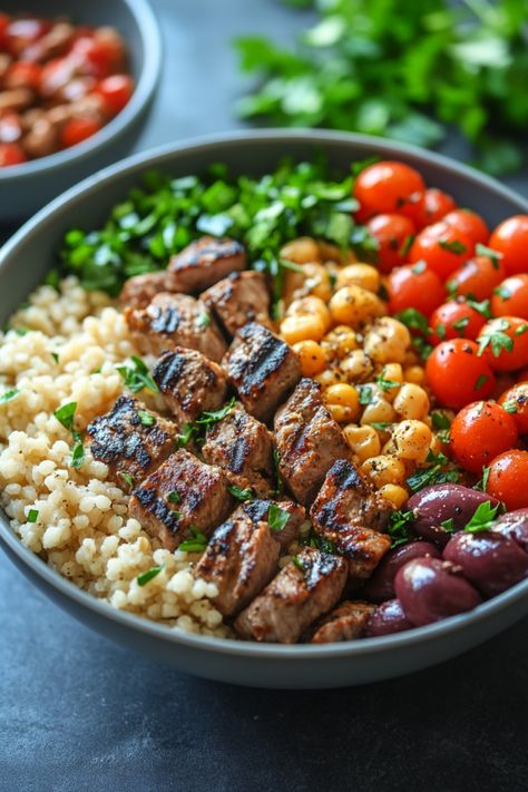 Grilled beef, couscous, cherry tomatoes, chickpeas, olives, and parsley in a bowl. Mediterranean Diet For Liver Health, Mediterranean Diet On The Go, Mediterranean Diet One Pan Recipes, Beginner Healthy Meals, Mediterranean Diet Easy Dinner, Easy Meal Prep Mediterranean Diet, Medditeranean Food Mediterranean Recipes, Fresh Mediterranean Recipes, Mediterranean Diet Whole Grains