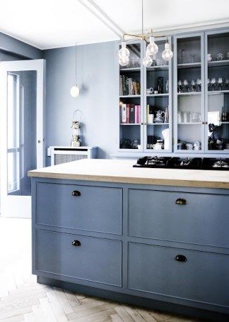 close up of blue cabinets in an entirely blue kitchen with herringbone wood floors Quirky Kitchens, Blue Kitchen Walls, Blue Kitchen Designs, Kitchen Design Centre, Kitchen Cabinet Accessories, Light Blue Kitchens, Interior Design Blogs, Wooden Kitchen Cabinets, Herringbone Wood Floor