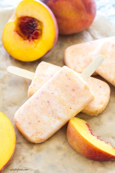 These easy peach popsicles are made with Greek yogurt and honey, making them a healthy way to stay cool in the heat! | www.alattefood.com Greek Yogurt And Honey, Greek Yogurt Popsicles, Yogurt Popsicle Recipes, Honey Making, Peach Popsicles, Breakfast Popsicles, Frozen Yogurt Popsicles, Stay Cool In The Heat, Healthy Popsicle Recipes