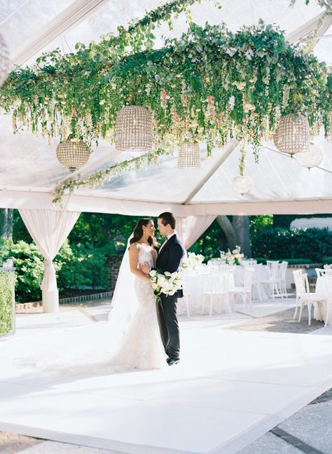 Bride and groom on their white dance floor with hanging flowers in clear tent at Charleston wedding. White Dance Floor Wedding, Tent Dance Floor, Clear Tent Wedding, White Dance Floor, Wedding Dance Floor, White Dance, Clear Tent, Dance Floor Wedding, Bride Groom Photos