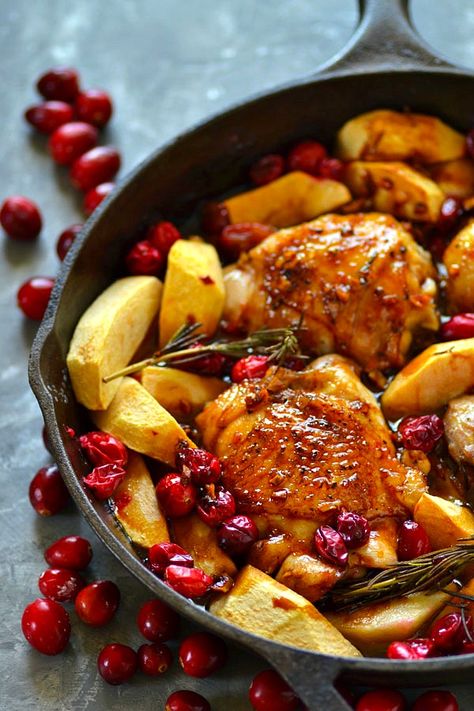 Juicy chicken thighs are roasted in tangy cranberries, soft apples, and covered in a sweet maple glaze for the EASIEST way to do chicken holiday-style! Soft Apples, Chicken With Apples, Maple Glazed Chicken, Juicy Chicken Thighs, Maple Chicken, Cranberry Chicken, Roasted Chicken Thighs, Supper Ideas, Cooking Healthy