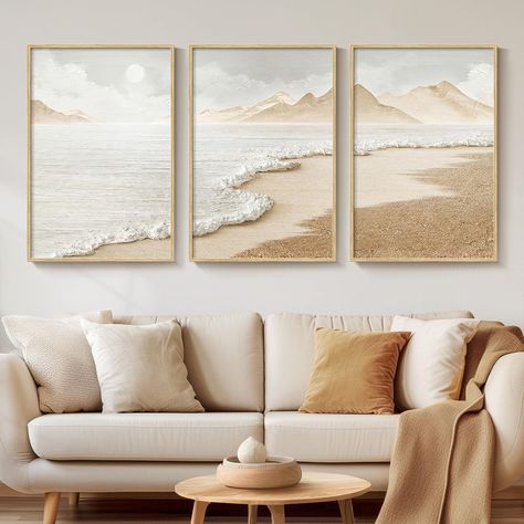 PRICES MAY VARY. [Framed Wall Art]: Set of 3 framed neutral coloured abstract beach wall art, each measuring 16x24 inches. Frames are made of durable, rust-resistant metal and finished in a natural wood colour to simulate the texture of real wood. [Canvas Artwork for Walls]: Our 2D prints artwork is made of waterproof canvas which is waterproof and easy to maintain. The canvas has a unique texture that enhances the visual effect of the image, saturates the colours, keeps the painting colourful f Modern Minimalist Coastal Decor, Calming Bedroom Artwork, Coastal Living Room Wall Decor Ideas, Large Framed Canvas Wall Art, Painting Ideas On Canvas 3 Piece, Above The Bed Artwork, Coastal Chic Home Decor, Picture Frames Above Couch, Boho Beach Living Room