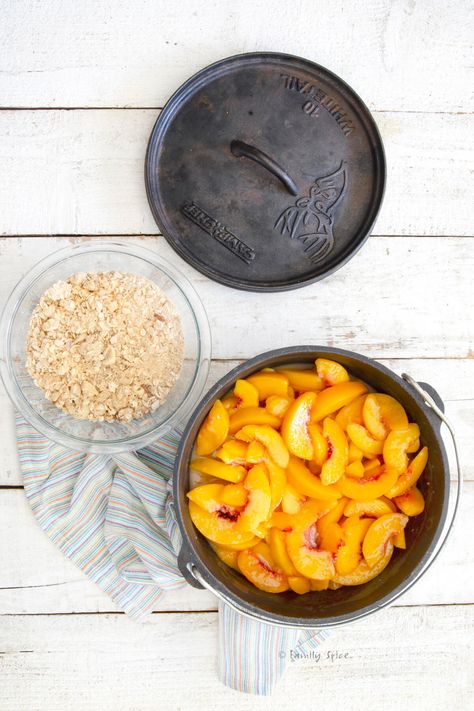 Whether you are out camping or have a hankering for peach crisp at home, this Campfire Dutch Oven Peach Crisp with Almonds is easy to whip up with plenty of the crunchy crisp topping everyone loves. -- FamilySpice.com Crisp Topping, Peach Crisp, Dutch Oven Recipes, Camping Recipes, Cast Iron Cooking, Camping Meals, Dutch Oven, Campfire, Almond