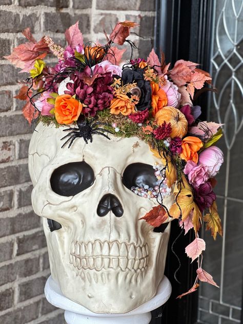 Transform your space into a hauntingly beautiful setting with our Extra-Large Halloween Floral Skull Decor. This striking piece combines the eerie allure of a skull with the timeless beauty of flowers, making it the perfect centerpiece for your Halloween festivities or a year-round statement piece for gothic or eclectic interiors. Why You'll Love It This Extra-Large Halloween Floral Skull Decor blends the macabre with the beautiful, creating a piece that's as intriguing as it is decorative. Its Skull Decor Halloween, Floral Halloween Decor, Whimsical Halloween Decor, Flower Diy Paper, Witchy Party, Skull Centerpiece, Spooky Crafts, Paper Flower Diy, Festive Halloween Decor