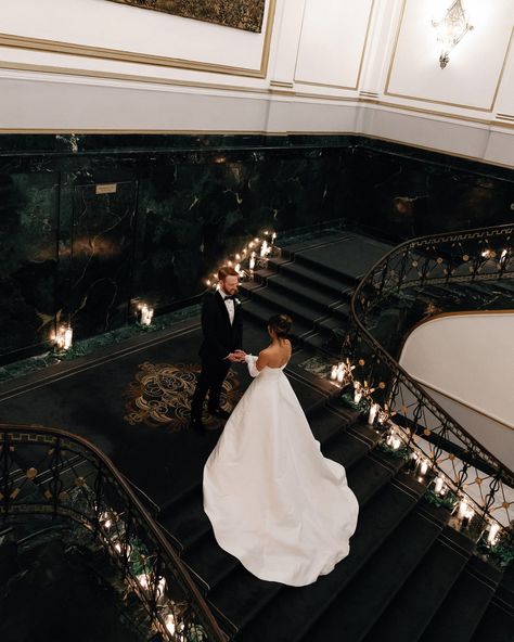 A Midnight Kiss at a Boston New Year’s Eve Wedding✨ Alie and Zach’s winter wedding theme of elegant, moody, classic glam was beautifully brought to life by @bameventsbos. The sophisticated color palette, enriched with gold accents and abundant candlelight, perfectly matched their vision. The photos by @cityluxstudios not only captured the couple’s happiness and the venue’s grandeur but also added a timeless elegance with black-and-white images that embodied the glam of their New Year’s Eve c... Classic Black White And Gold Wedding, Black Tie New Years Eve Wedding, Winter Wedding Classy, Winter Wedding Black Tie, New Year’s Eve Wedding, New Years Eve Wedding Ideas, Winter Wedding Locations, Winter Wedding Aesthetic, Sophisticated Color Palette