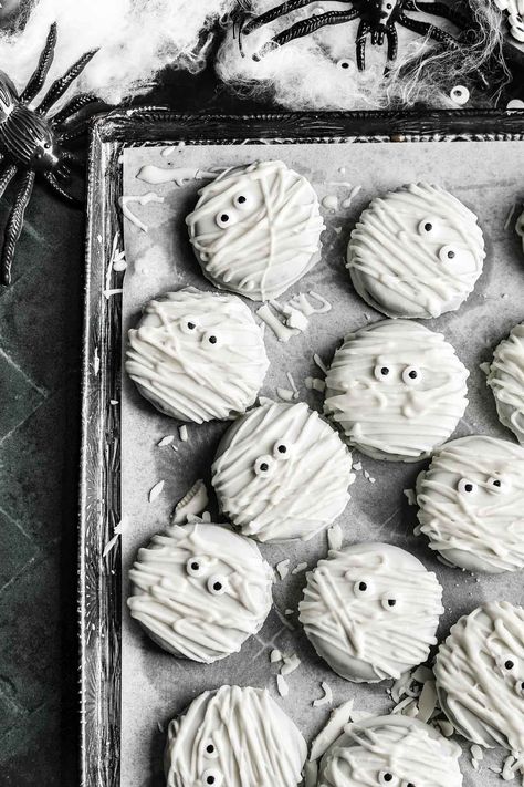 Oreo Mummy Cookies are the perfect spooky Halloween treat for parties, school events, or simply to enjoy at home with family and friends. These are made by coating Oreo cookies in white chocolate, then adding candy eyeballs and drizzling more white chocolate to create a mummy’s bandage-like appearance. Mummy Cookies, Candy Wafers, Butternut Squash Soup Recipe, Spooky Halloween Treats, White Chocolate Candy, Halloween Party Treats, Candy Eyeballs, Squash Soup Recipe, Roasted Butternut Squash Soup